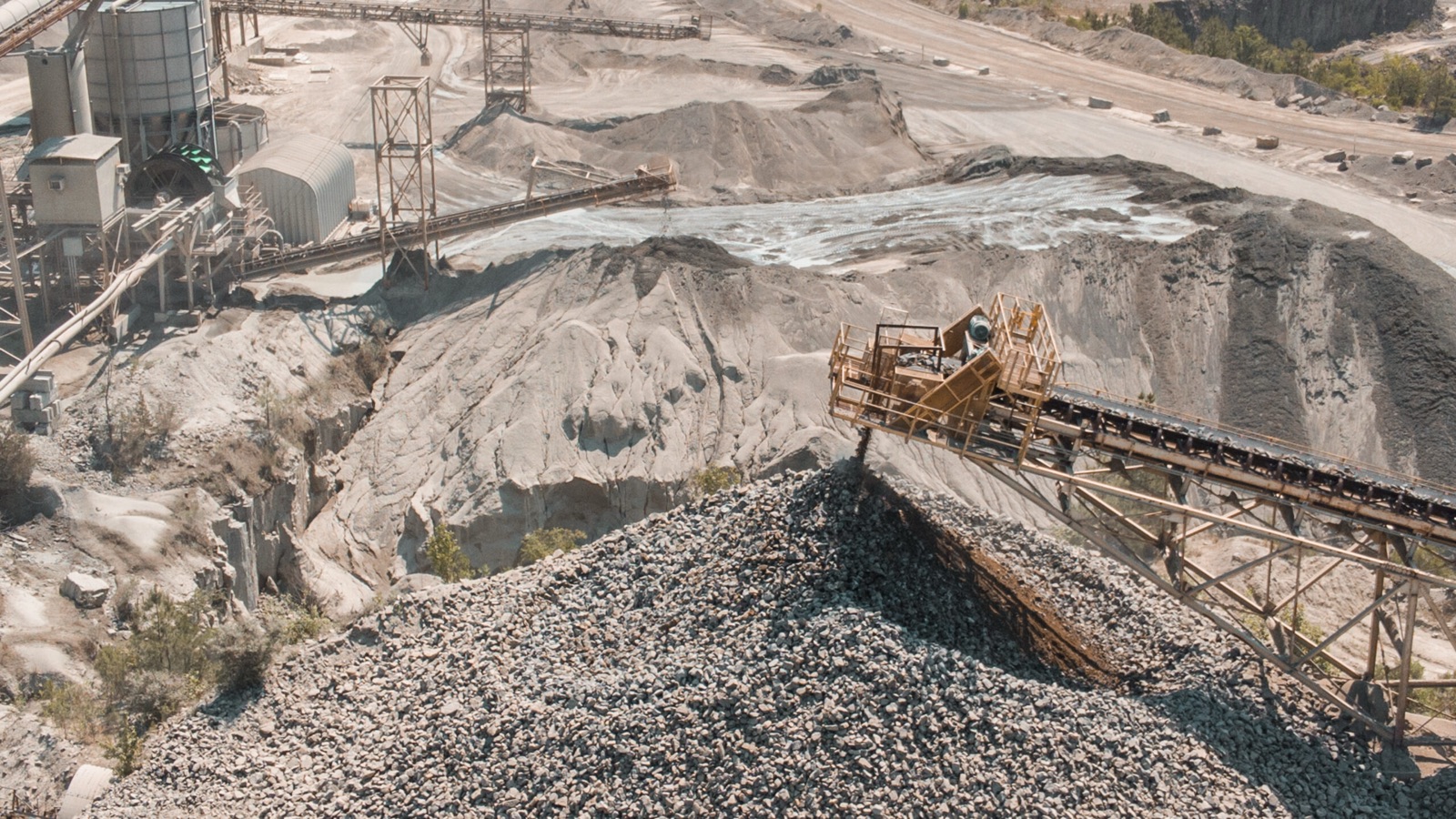 Crushers, conveyors, and stockpiles at a Sunrock plant